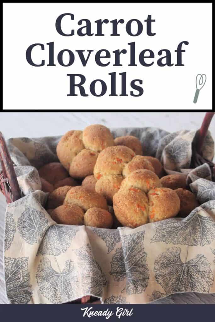 A napkin lined basket full of carrot cloverleaf rolls with text overlay.