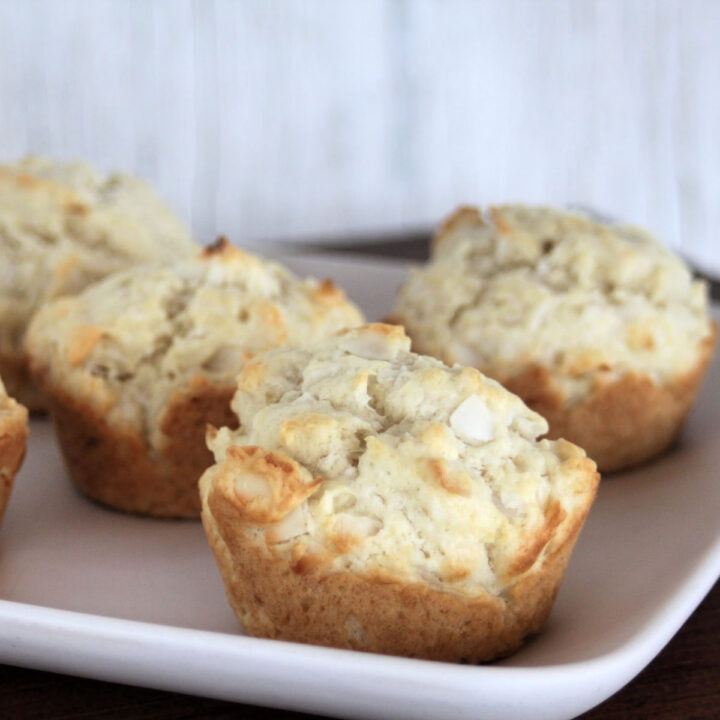 Coconut muffins on a white plate.