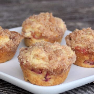 Rhubarb muffins on a square white plate.