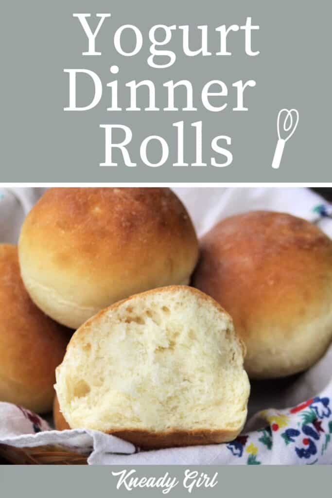 A dinner roll torn in half exposing the inside sitting inside a full basket of rolls with text overlay. 