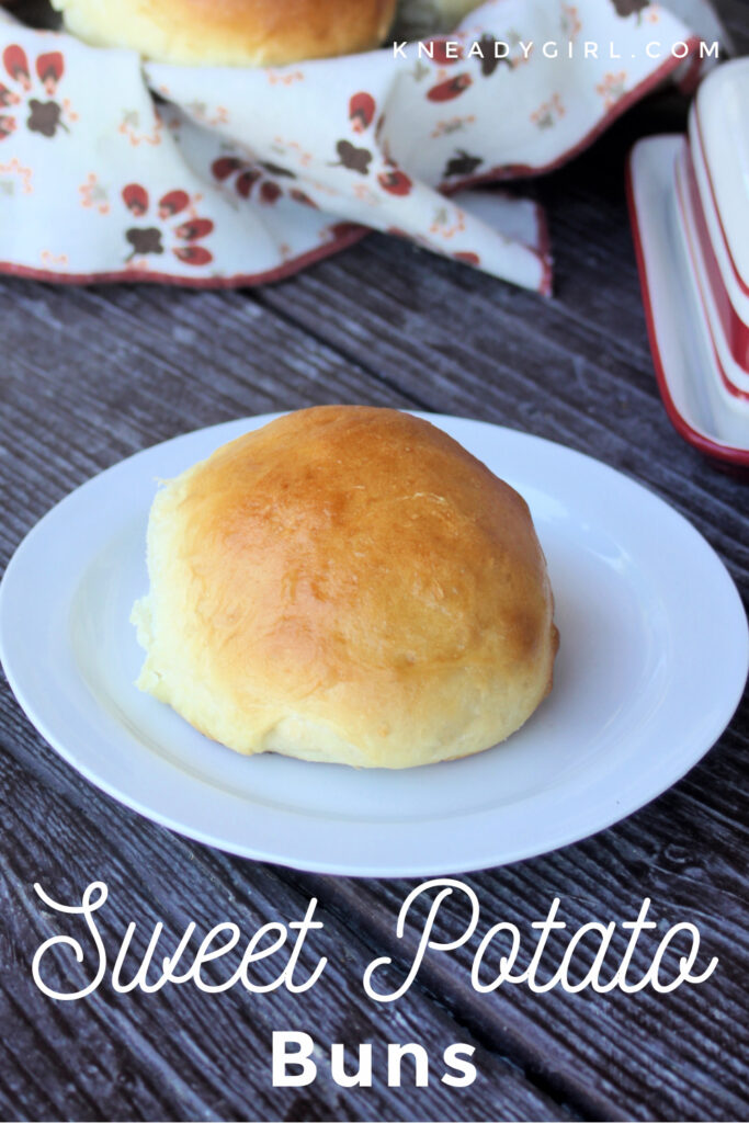 A sweet potato bun on a white plate with text overlay.