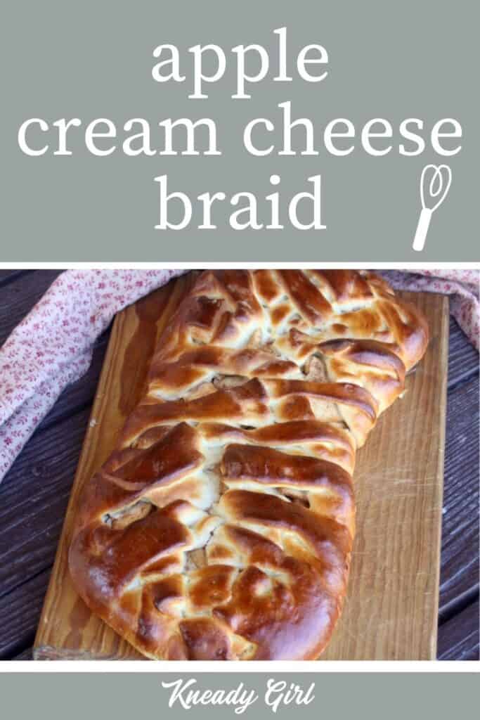 An apple cream cheese braid on a wooden cutting board with a napkin behind it and a green apple with text overlay.