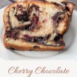 Slices of chocolate cherry babka on a white plate with text overlay.