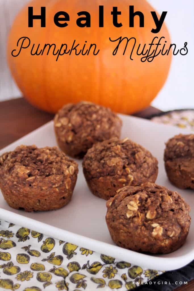 Healthy pumpkin muffins on a square white plate with a pumpkin in the background and text overlay.