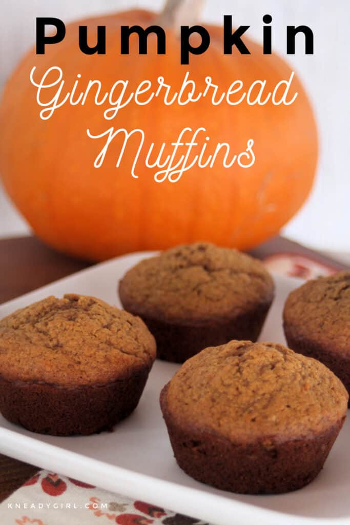 Pumpkin gingerbread muffins on a white plate with a pumpkin in the background with text overlay.