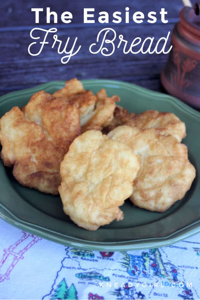 Pieces of fry bread stacked on a green plate sitting on a white linen with text overlay stating - the easiet fry bread.