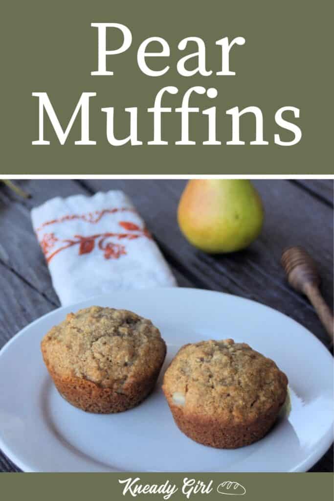 2 muffins on a white plate with a napkin, fresh pear, and honey dipper in the background. Includes text overlay stating: pear muffins.