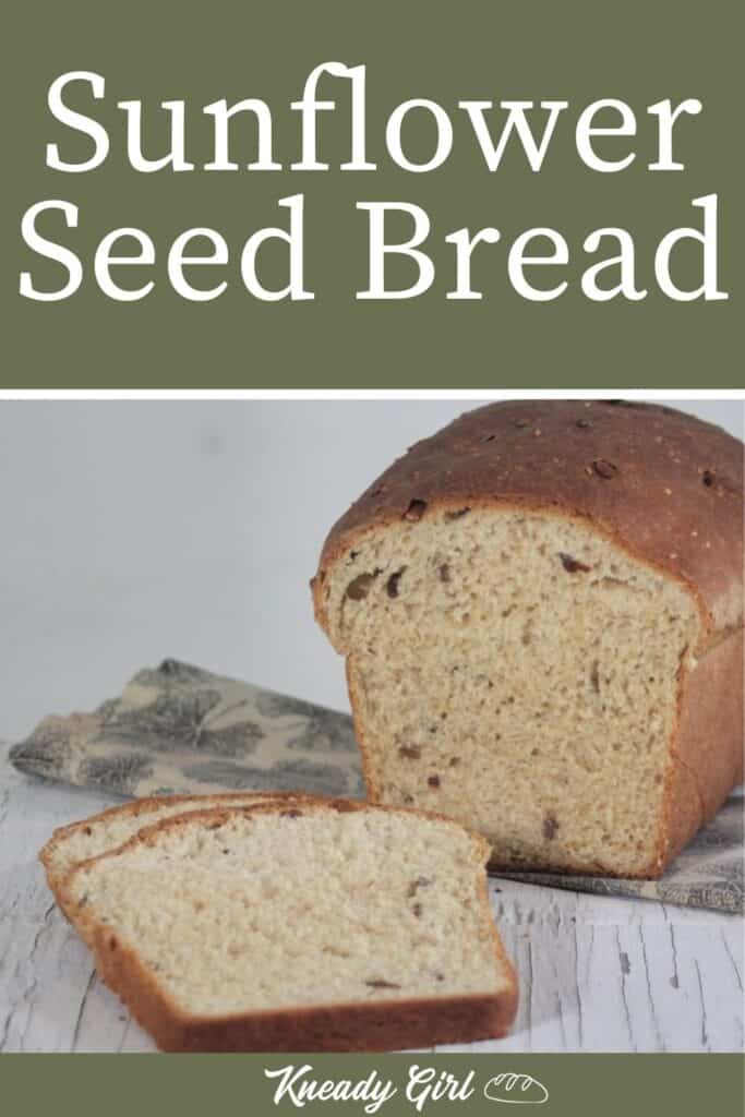 Slices of bread sitting on a table in front of the rest of the loaf resting on a napkin with text overlay reading: Sunflower Seed Bread. 