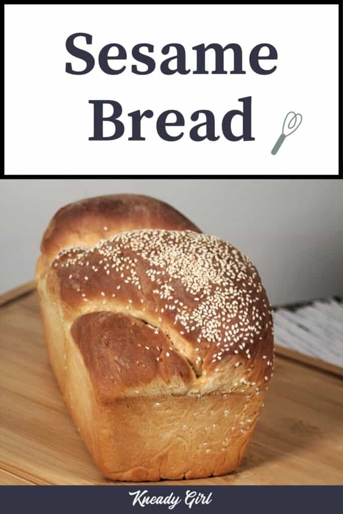 A loaf of bread topped with sesame seeds sitting on a cutting board with text overlay stating: Sesame Bread.