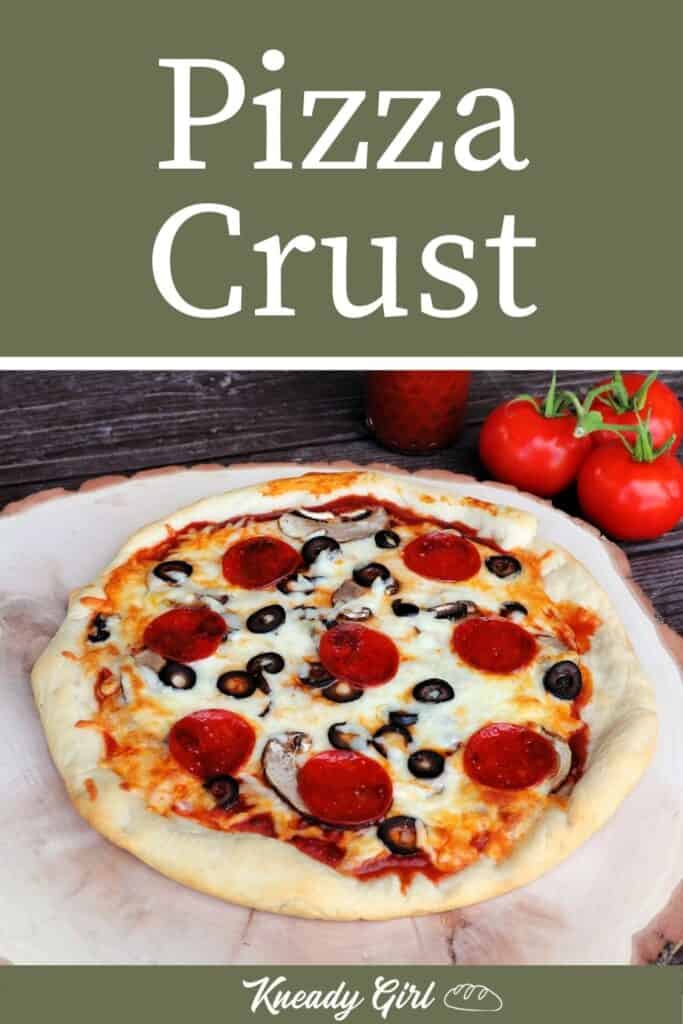 A pizza with pepperoni, olives, and mushrooms sitting on a round wooden board with fresh tomatoes in the background and text overlay reading: pizza crust.