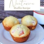 3 nectarine muffins on a plate with a white napkin sitting to the right and a cup of coffee in the background with text overlay reading nectarine muffin recipe.