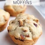 Close-up of a muffin on a plate with text overlay that reads: homemade date muffins.