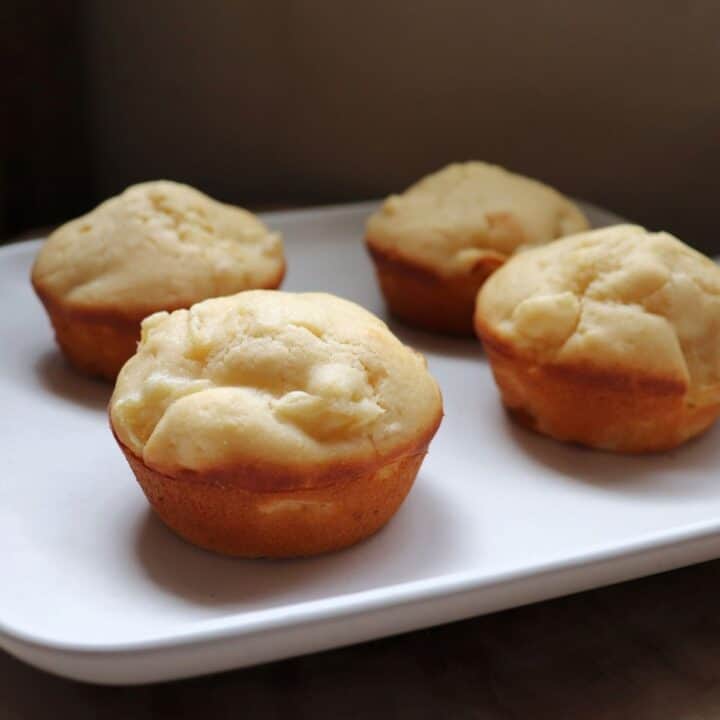 Pineapple muffins on a square, white plate.