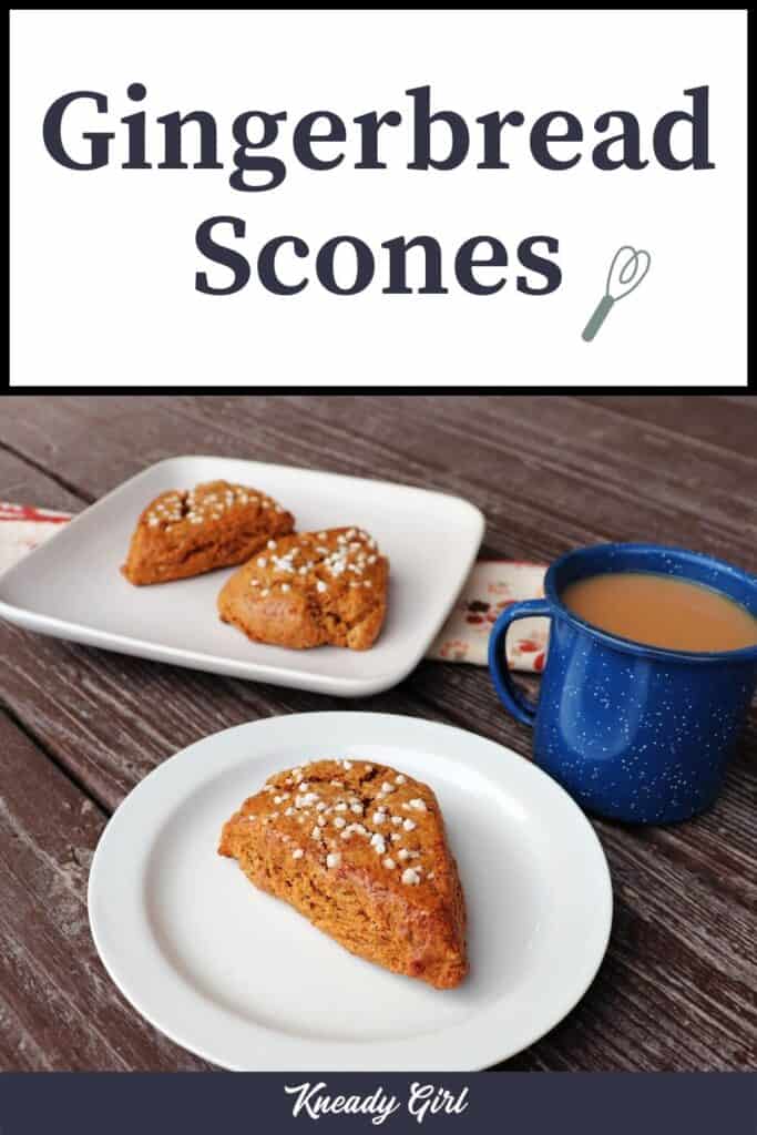 A white plate with a scone sitting on it, a blue cup full of tea next to it, a square plate with 2 scones on it in the background. Text overlay reads: Gingerbread Scones.
