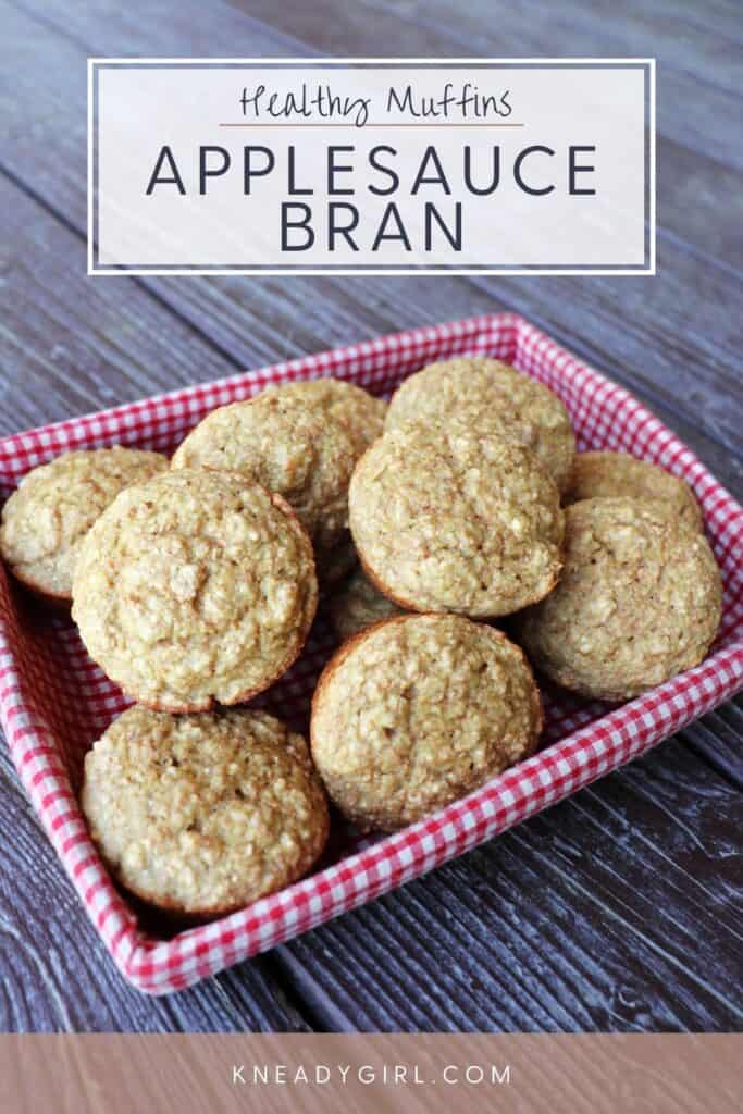 Muffins stacked in a basket lined with a red and white checkered cloth. Text overlay reads: Healthy Muffins Applesauce Bran.