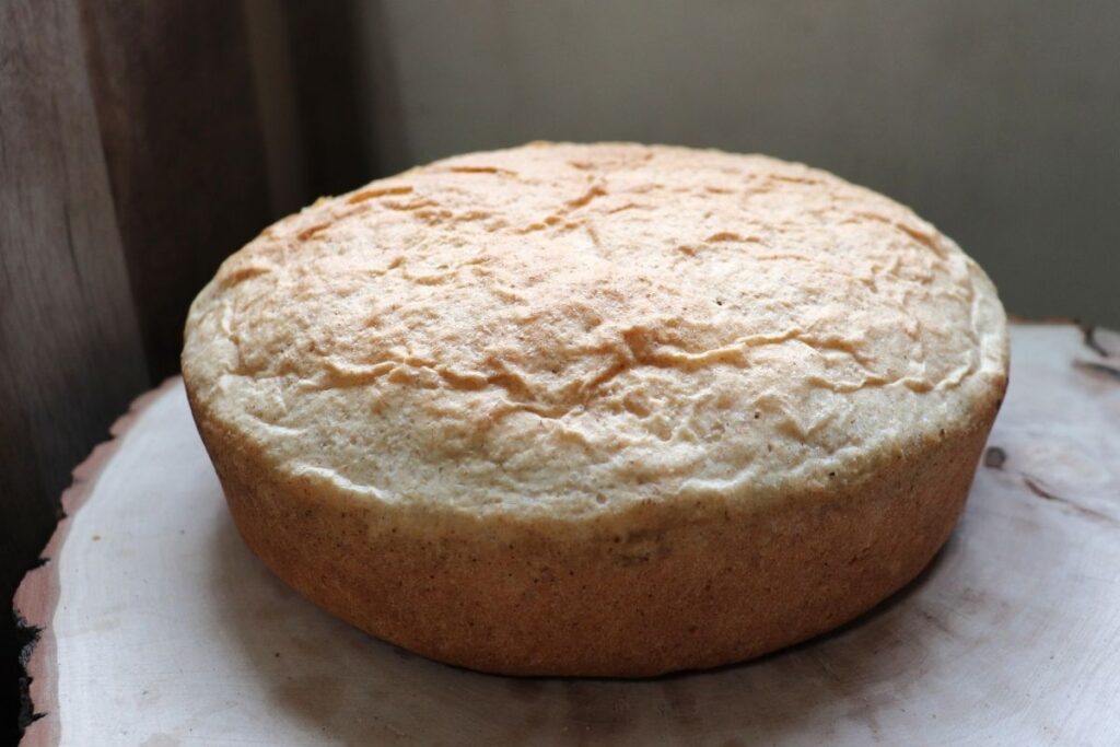 A loaf of shepherd's bread sitting on a cutting board.