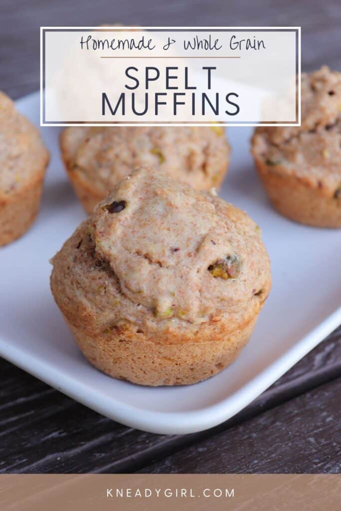Close up of a muffin on a platter with other muffins behind it. Text overlay reads: Homemade, whole grain Spelt Muffins
