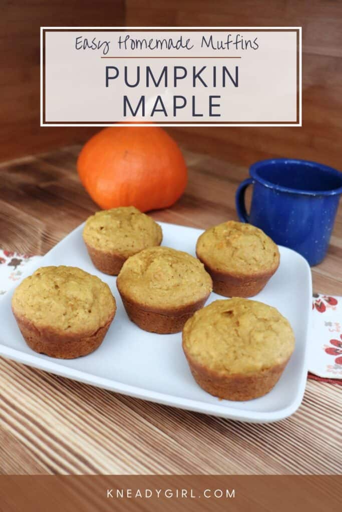 A plate of muffins sits on top of a napkin with a blue tin cup and fresh pumpkin in the background. Text overlay reads: Easy Homemade Muffins - Pumpkin Maple. 