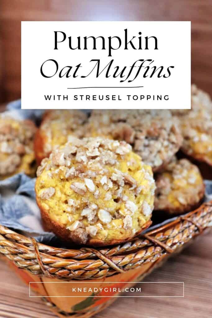 A close up of a mufifn in a basket full of more muffins. Text overlay reads: Pumpkin oat muffins with streusel topping. 