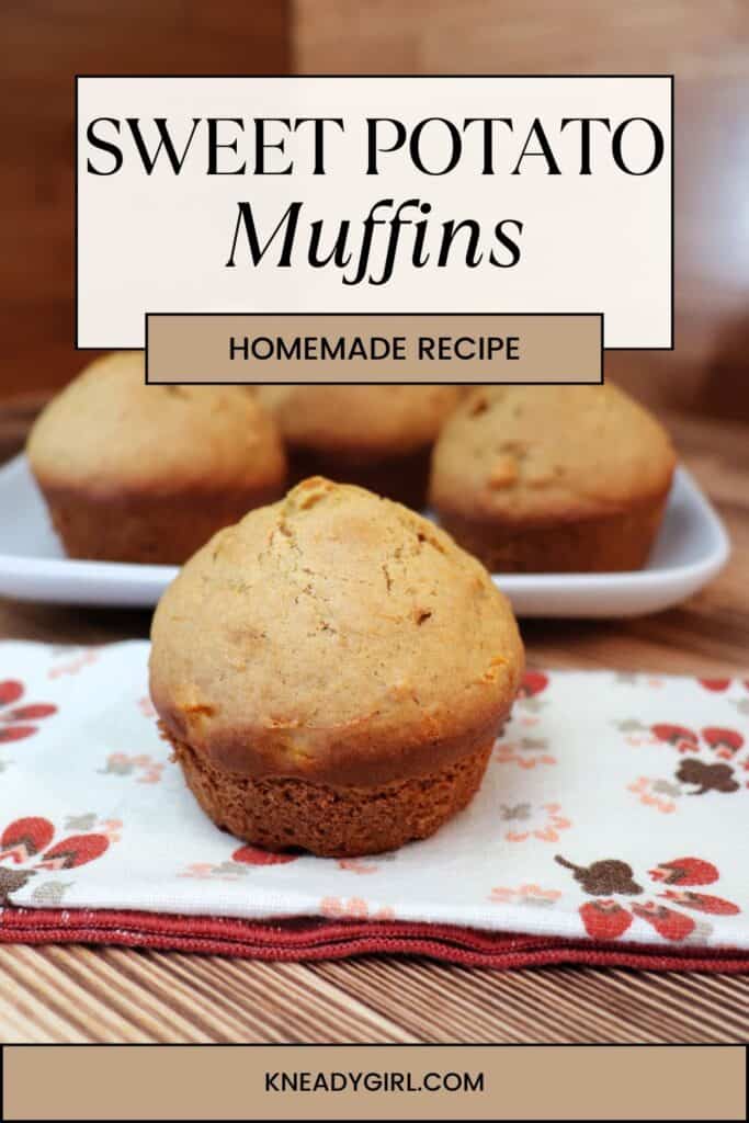 A muffin sits on a printed napkin with a platter of more muffins behind it. Text overlay reads: Sweet Potato Muffins - Homemade Recipe. 