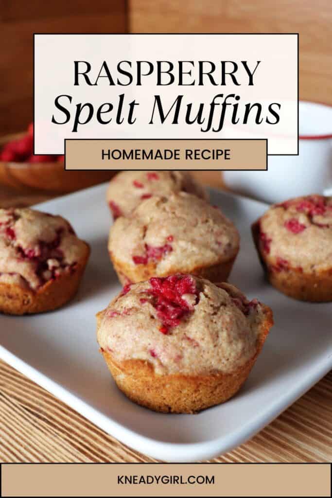 Raspberry muffins sit on a square white plate. Text overlay reads: Raspberry spelt muffins, homemade recipe.